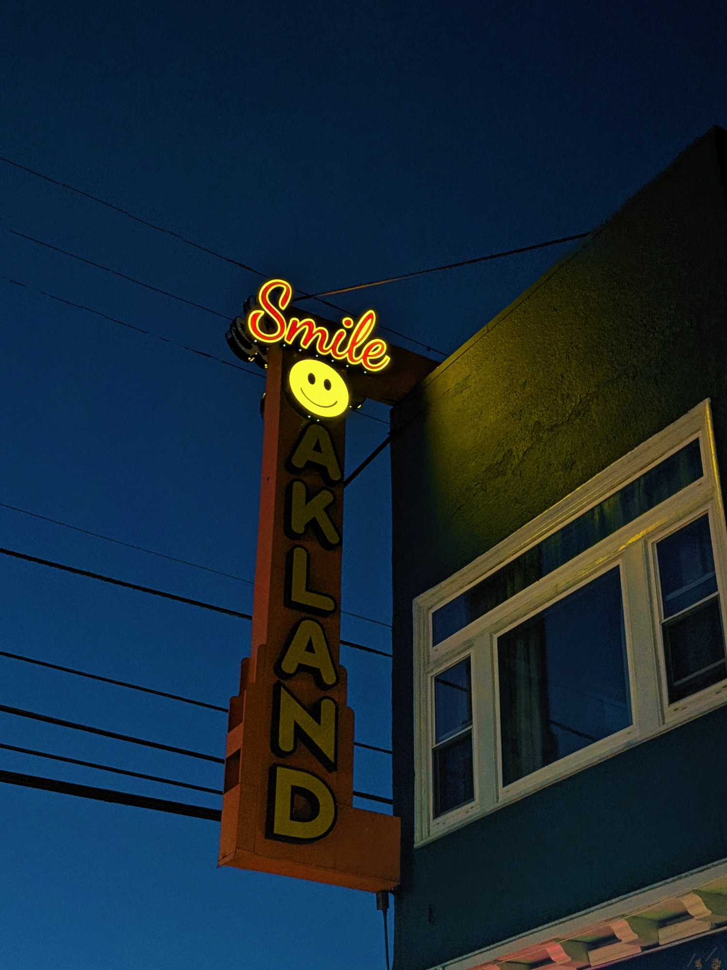 Glowing smiley sign at night